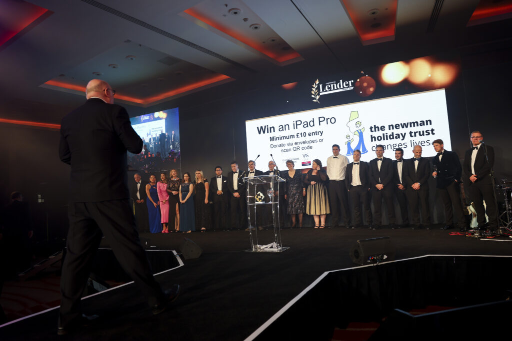 A game of Heads & Tails raising funds for Newman Holiday Trust at the NACFB Commercial Lender Awards 2023